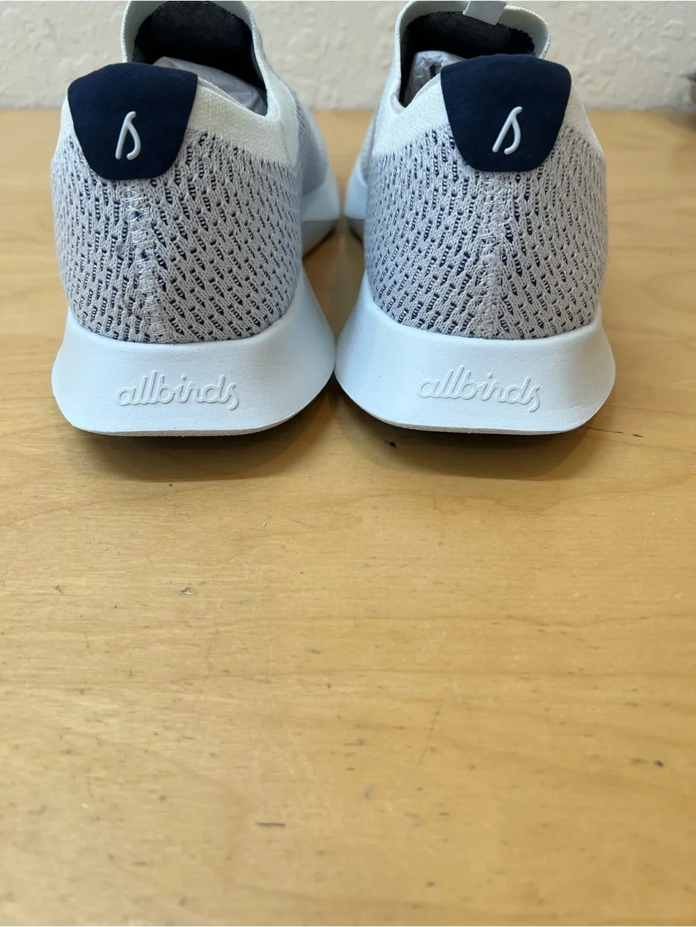 allbirds Men's US 13,5 Slip-On Knit Sneakers - White and navy.